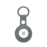 Apple AirTag holder in a gray leather case on a white background