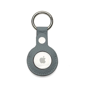 Apple AirTag holder in a gray leather case on a white background