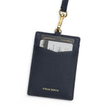 navy cardholder with gold accent and 'Hiram Beron' branding on a white background