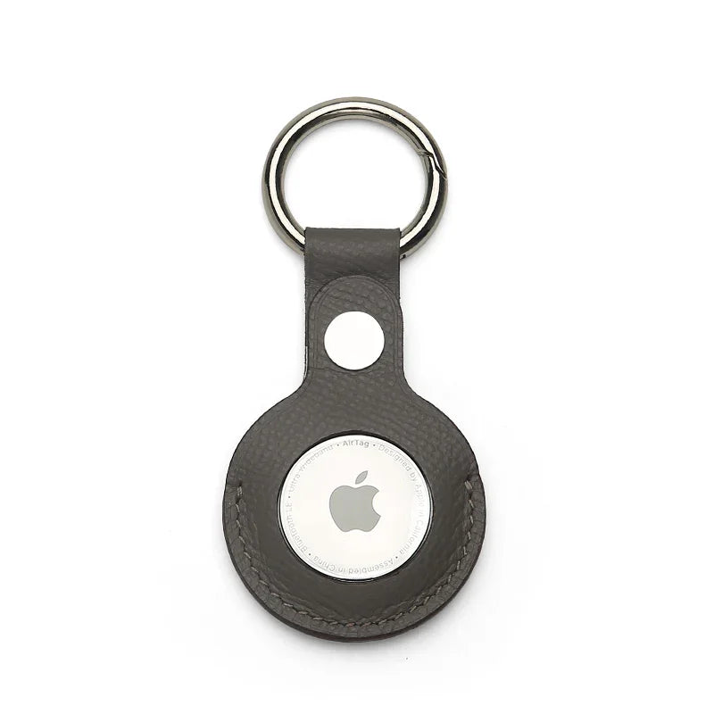 Grey epsom leather airtag keychain on a white background
