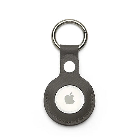 Grey epsom leather airtag keychain on a white background