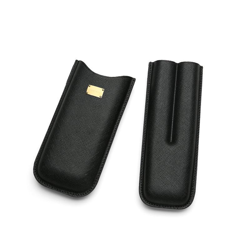 Black textured leather cigar case with gold plaque, open to show interior slots