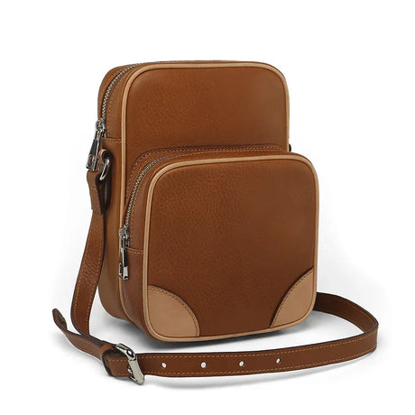 Brown vegetable tanned Leather Reporter Bag on a white background
