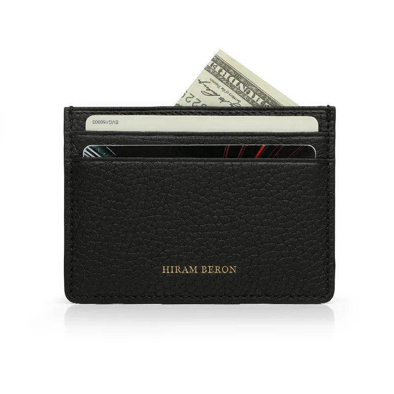 Black leather wallet with card slots and currency pocket on a white background, featuring the brand 'Hiram Beron'.