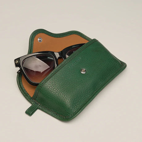 Internal view of leather glasses case featuring soft anti-scratch microfiber lining.