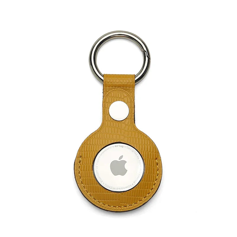 Yellow leather keychain holder on a white background