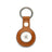 Orange leather Apple AirTag holder on a white background
