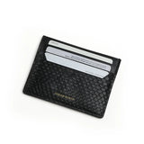 Black python skin cardholder with card slots on a white background