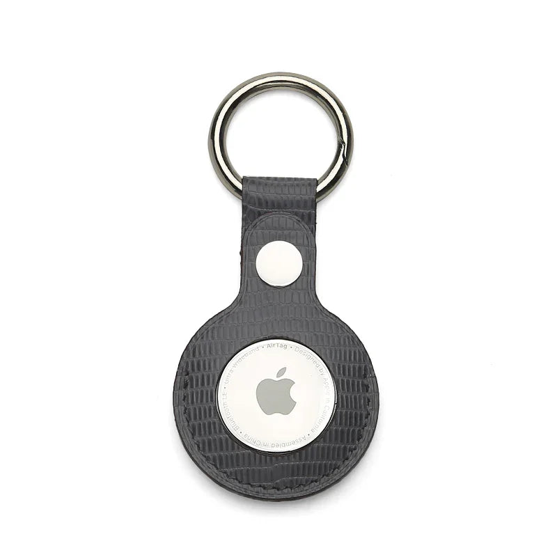 Grey leather keychain holder on a white background