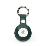 Green Leather Apple AirTag holder with silver ring on a white background