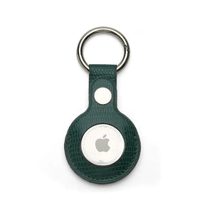 Green Leather Apple AirTag holder with silver ring on a white background