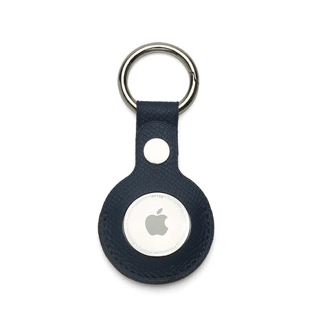 Navy epsom leather Apple AirTag holder on a white background