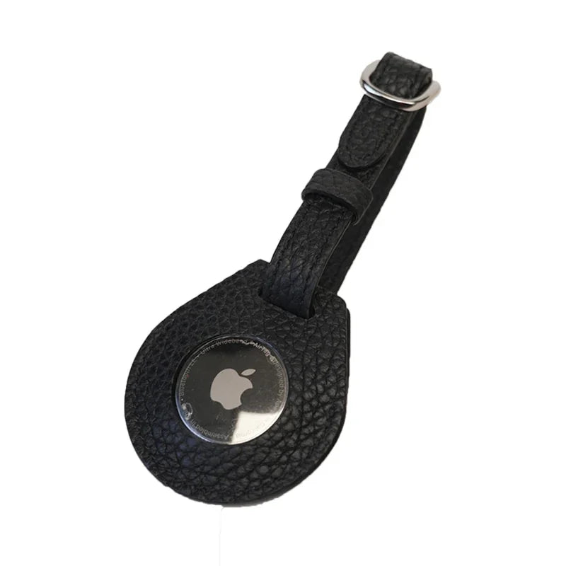 Black pebble leather airtag case with strap on a white background