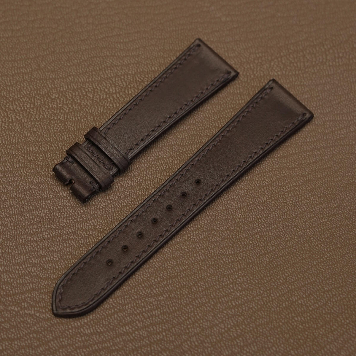 Pair of 1.8mm flat dark brown Haas Barenia leather watch bands showing smooth double-tanned grain   