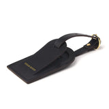 close-up of the edge for the black leather luggage tag