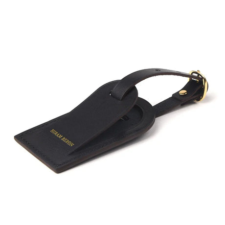 close-up of the edge for the black leather luggage tag