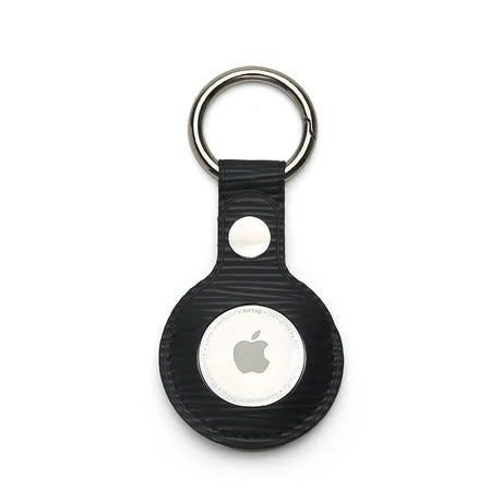 Black textured leather AirTag keychain with metal ring, sleek Apple tracker accessory for keys