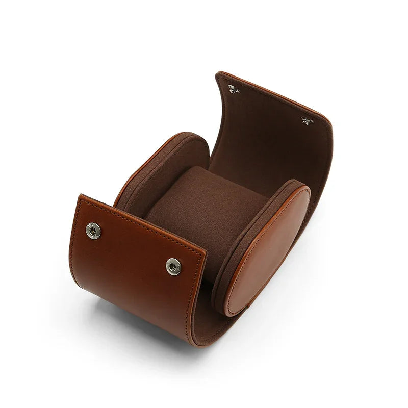 Handcrafted opened leather travel watch case with internal suede pillow and silver snaps.