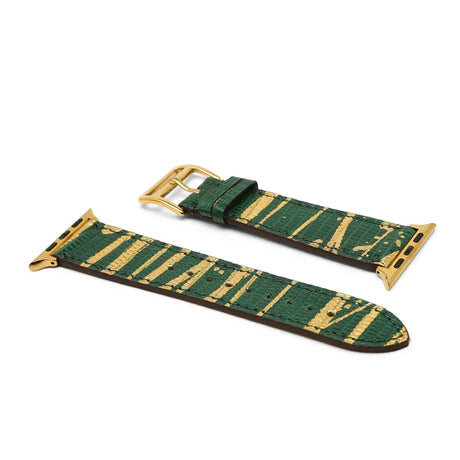 Green and gold lizard skin watch strap on a white background