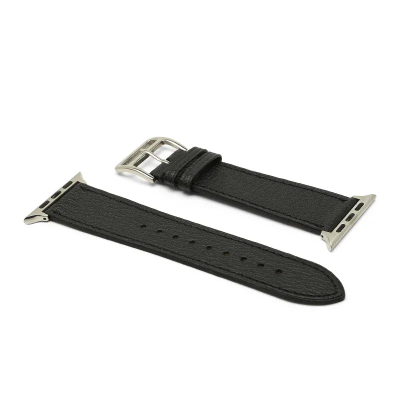 Black leather watch strap with silver buckle on a white background