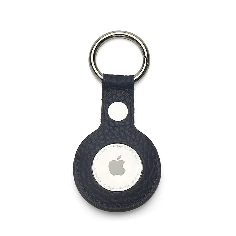 Navy blue leather airtag keychain with Apple logo on a white background