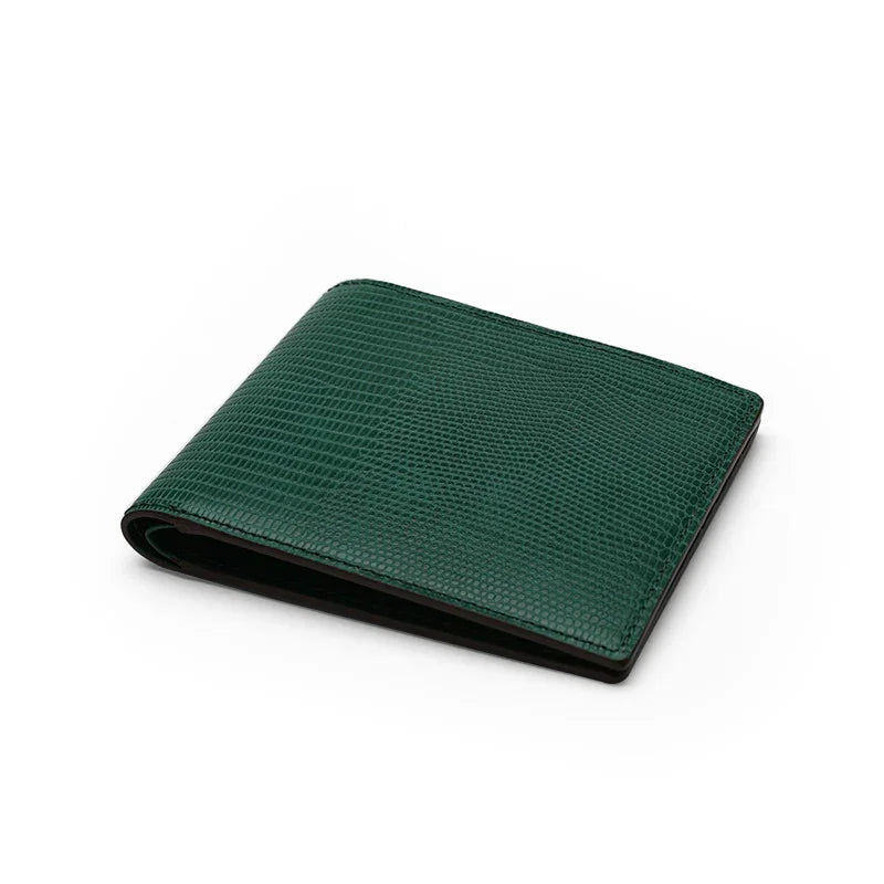 Green lizard pattern leather wallet on a white background