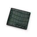 Green crocodile-patterned wallet on a white background