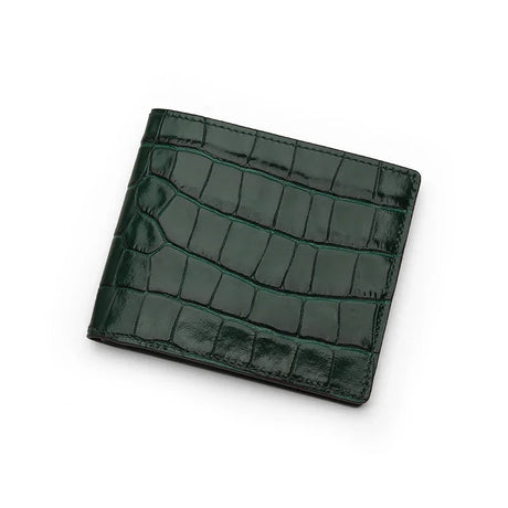 Green crocodile-patterned wallet on a white background