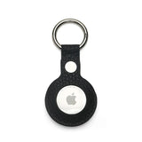 Black pebble leather airtag cover with Apple logo on a white background