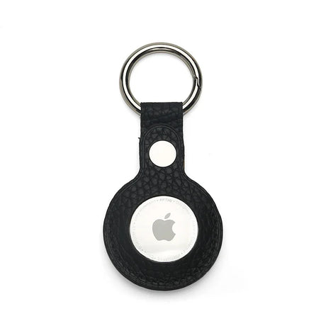 Black pebble leather airtag cover with Apple logo on a white background