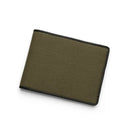 Green canvas wallet with black leather border on a white background