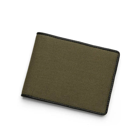 Green canvas wallet with black leather border on a white background