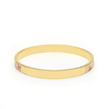 Gold bangle bracelet with floral enamel accents, elegant women's jewelry