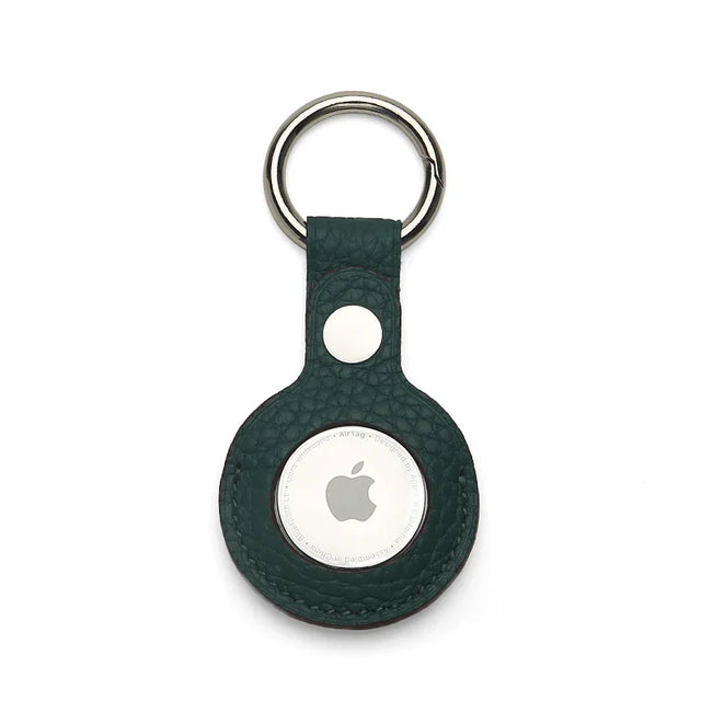 Green pebble leather Apple AirTag keychain holder on a white background