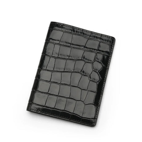 Glossy Black crocodile patterned passport holder on a white background