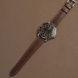 Complete brown Horween Chromexcel watch strap mounted on luxury titanium vintage dive watch   