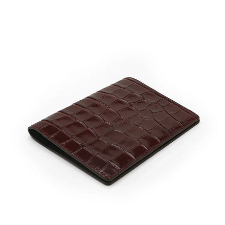 Front view of the burgundy passport wallet on a white background