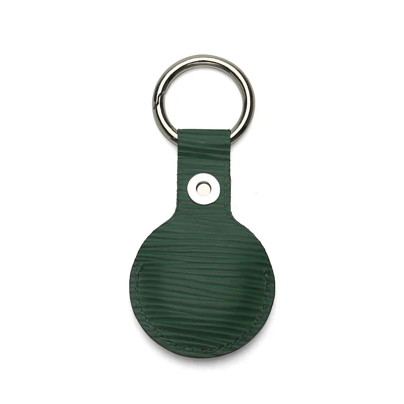 Green textured leather keychain with metal ring, premium accessory for everyday use