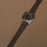 Complete dark brown Badalassi Carlo Minerva Liscio leather watch band mounted on luxury titanium dive watch 