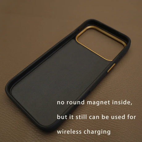 Black phone case with gold camera trim, wireless charging compatible, no round magnet inside