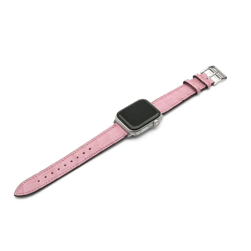 Pink watch strap on a white background