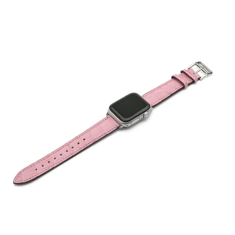 Pink watch strap on a white background