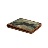 close-up of the leather wrapped edge for camouflage wallet  on a white background