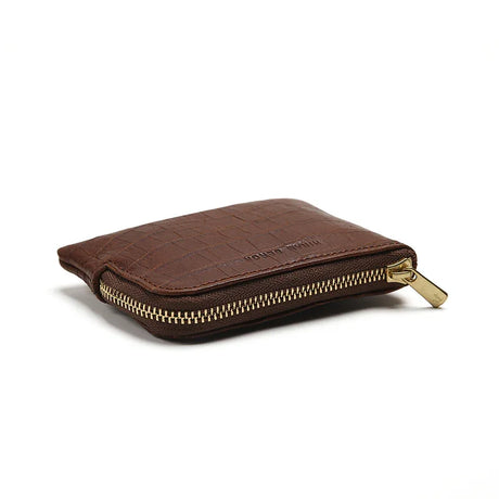Brown leather wallet with gold zipper on a white background