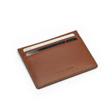 Brown buttero leather cardholder with visible brand name on a white background