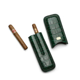Luxury green crocodile leather cigar case with gold plaque, holding premium cigars