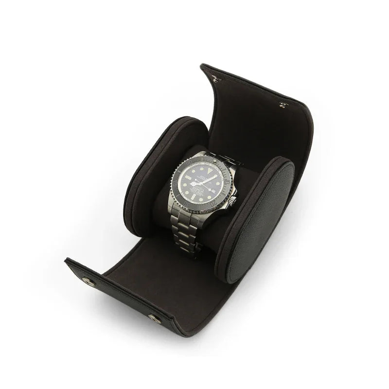 A men watch is sitting in the watch roll inside on a white background