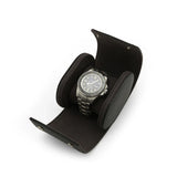 A men watch is sitting in the watch roll inside on a white background
