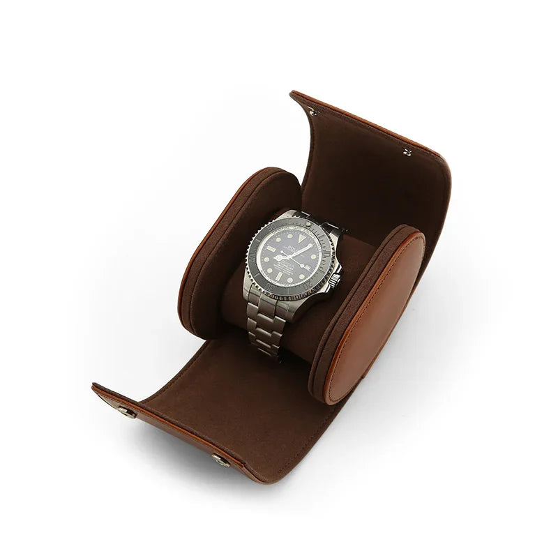 Silver watch in a brown leather display case on a white background