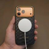 iPhone 17 pro case with a magsafe charging held by a hand against a brown background